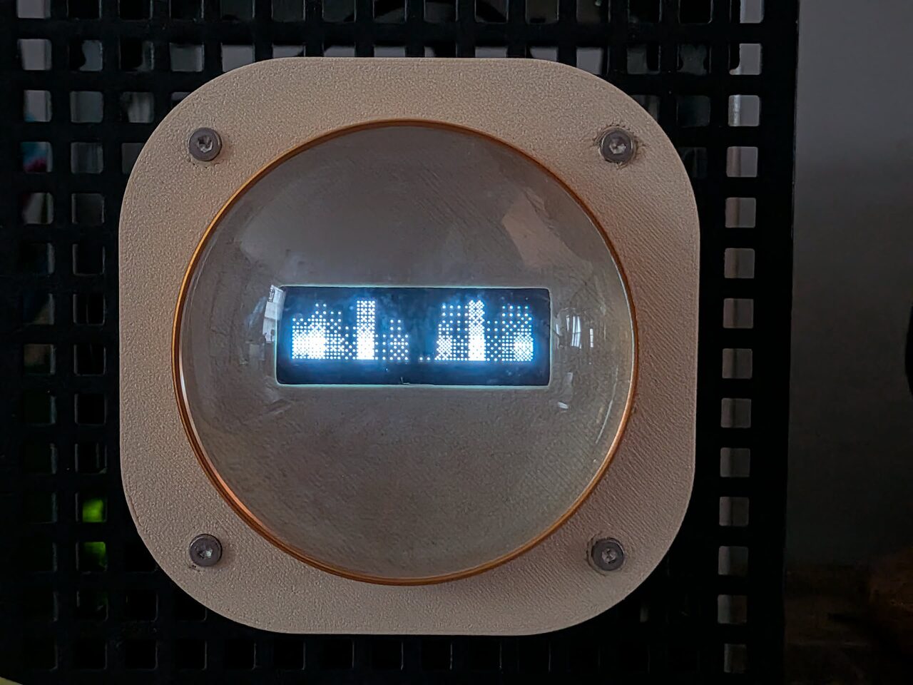 a ghee scene on a SPI dot-matrix panel behind a lens, audio bars driven live